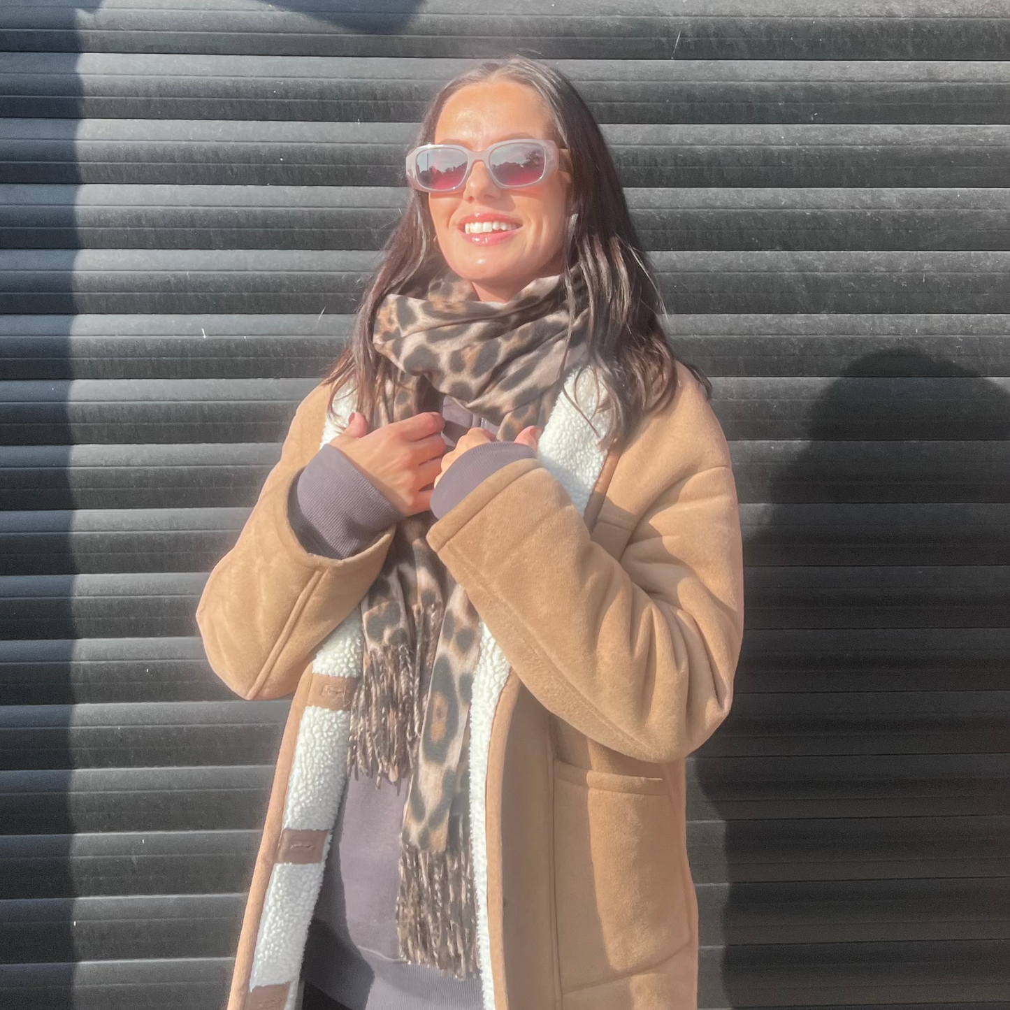 model wearing sunglasses with the sienna leopard print super soft scarf and the talula coord grey top